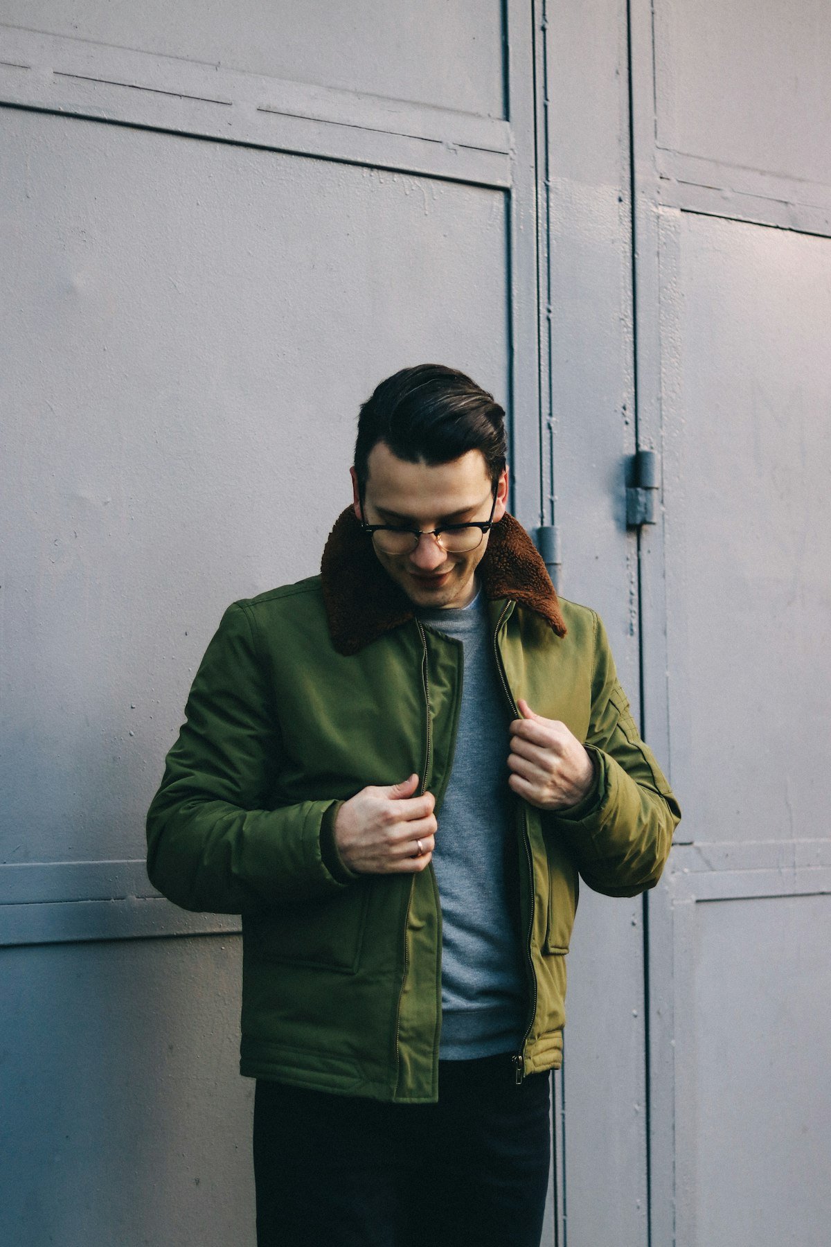 Field jacket over a crewneck sweater